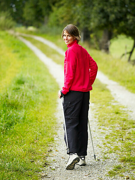 Bildagentur Mauritius Images Mature Woman Nordic Walking Smiling Portrait